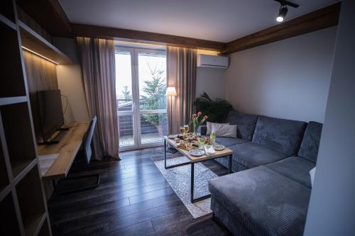 a living room with a couch and a table at Na Górce in Przemyśl