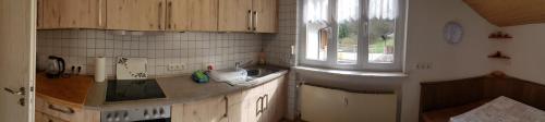 a kitchen with a sink and a window at Ferienwohnung, Monteurwohnung Steger in Frammersbach