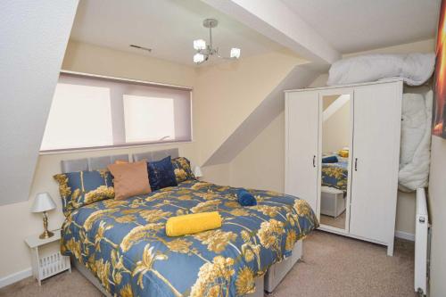 a bedroom with a bed and a large window at London's Calling You! 2 Bed Lovely Home Sleeps 1-5! in Thamesmead