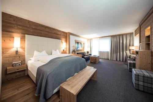 Ένα ή περισσότερα κρεβάτια σε δωμάτιο στο Hotel Chalet Das Alpenschlössel