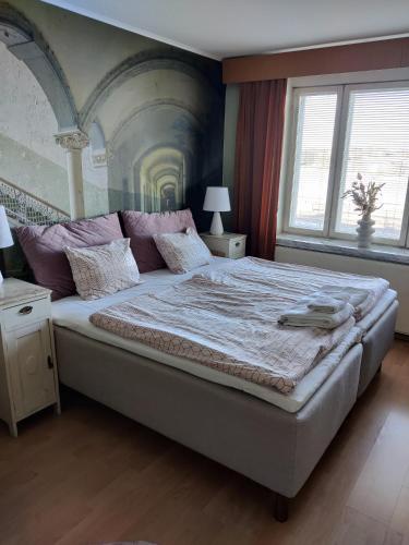 Postel nebo postele na pokoji v ubytování Hotelli Merikotka