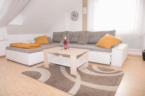 a living room with a couch and a coffee table at Ferienwohnung Rebekka in Riedlingsdorf