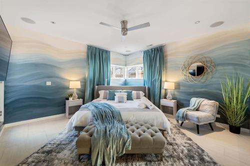 a bedroom with a large bed and a blue painting at 5BR 5BA Architectural Estate-Theatre Gym Rooftop in Chicago