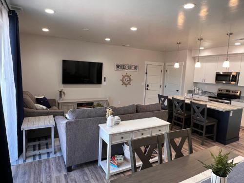 a living room with a couch and a table at Fish Lake Suite - Castle Rock Condos in Richfield