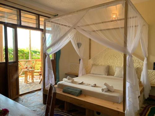 Ένα ή περισσότερα κρεβάτια σε δωμάτιο στο Villa's Tropical Sunset - New opening March 2024
