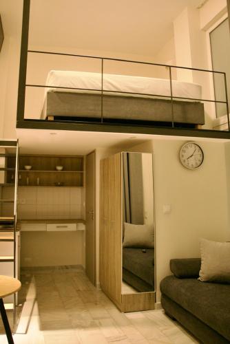 a small room with a bunk bed and a mirror at Piraeus Relax in Piraeus