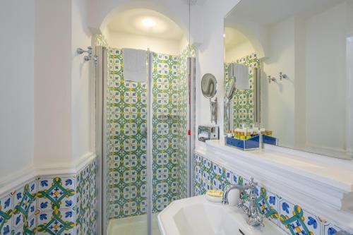 a bathroom with a sink and a shower at Le Ancore Hotel in Vico Equense