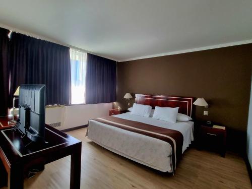 Ein Bett oder Betten in einem Zimmer der Unterkunft Hotel El Araucano