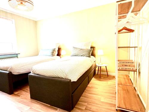 a bedroom with two beds and a ladder at Business- Apartment Worms # guesthouse- Monteure willkommen in Worms