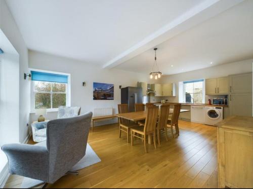 a kitchen and dining room with a table and chairs at Grade II listed house with river and castle views - Barnard Castle in Barnard Castle