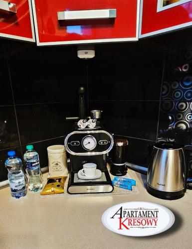 a coffee maker sitting on top of a counter at APARTAMENT KRESOWY parter 3 pokoje duża łazienka kabino-wanna SPA wi fi ekspres 2x smart tv antresola parking free plac zabaw bilet na aquapark 150m w cenie in Hrubieszów