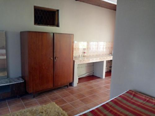 a bathroom with a counter and a cabinet in a room at Maliga Inn in Gampola