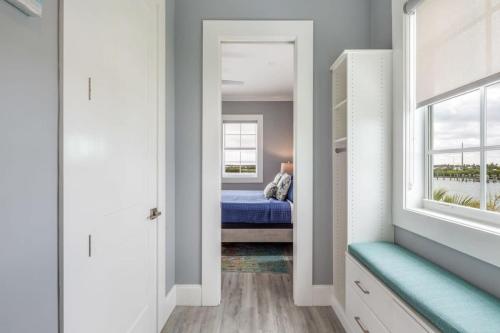 a bedroom with a bed and a window at Mastway House -Pool & Dock! in Key West