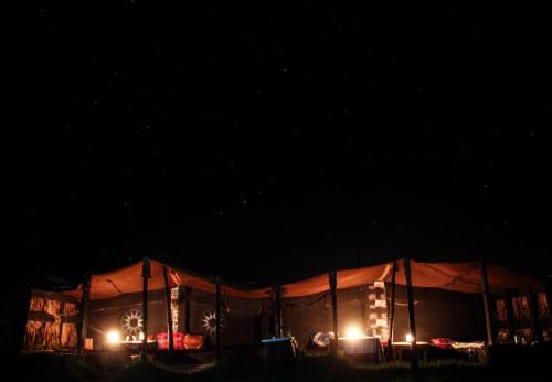 a large tent with lights in the dark at sidi kaouki ayt karoum in Sidi Kaouki