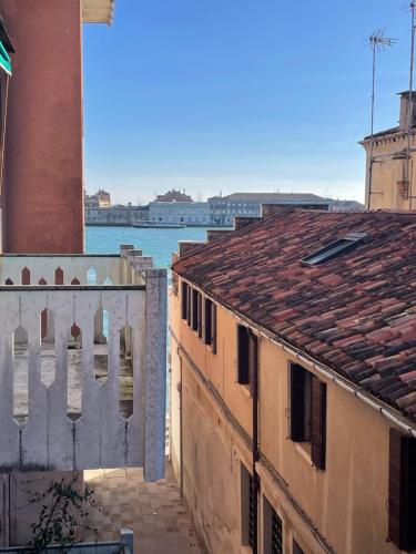 a view of the water from between two buildings at Zattere apartment - Casa Gardella in Venice