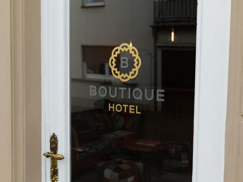 a door with a boutique hotel sign on it at Boutique Hotel in Bad Salzuflen