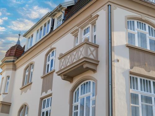 a building with a balcony on the side of it at Boutique Hotel in Bad Salzuflen