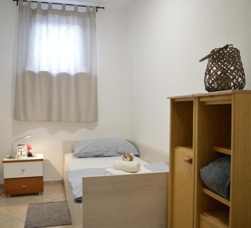 Ένα ή περισσότερα κρεβάτια σε δωμάτιο στο Apartman SaŽiv