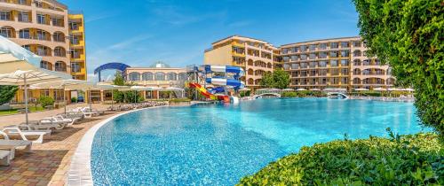 a large swimming pool with a slide in a building at DL Apartments in Aheloy