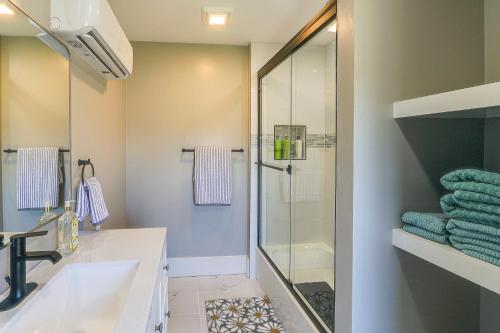 a bathroom with a sink and a shower at Riverfront Newton Vacation Rental Near Wichita! in Newton