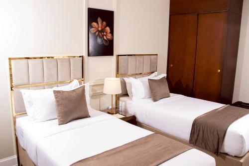 Postel nebo postele na pokoji v ubytování Rose Park Apartment hotel