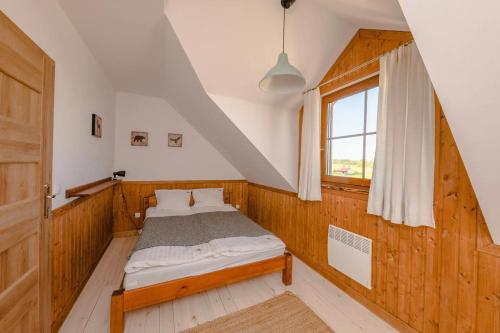 Postel nebo postele na pokoji v ubytování Domek na Kaszubach A129/1- Kaszubska Ostoja