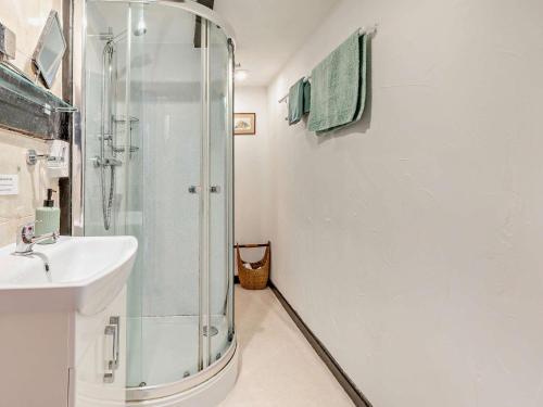 a bathroom with a shower and a sink at 2 bed in Woolacombe 57907 in West Down
