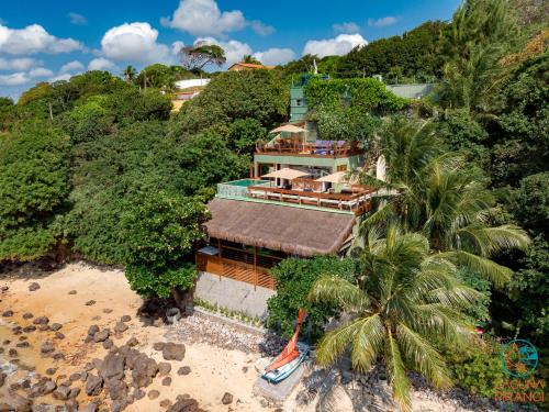 an aerial view of a house on the beach at Laguna Pirangi Beach House in Parnamirim