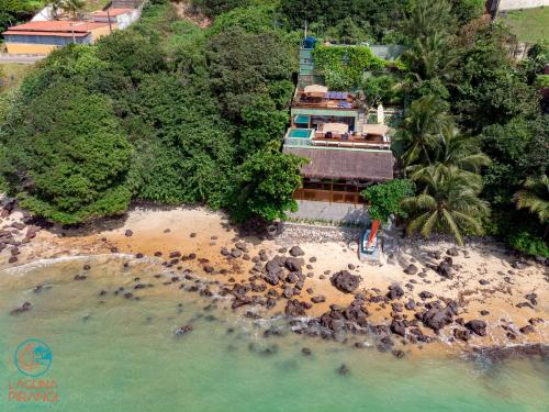 an aerial view of a house on a beach at Laguna Pirangi Beach House in Parnamirim