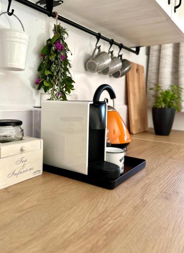 a microwave sitting on top of a kitchen floor at Anerada Cottages in Apsiou