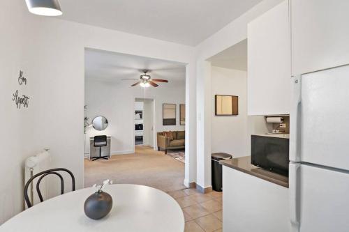 a kitchen and living room with a table and a refrigerator at Sleek 1-Bedroom Apt in Chicago - East Park Tower 0610 rep in Chicago