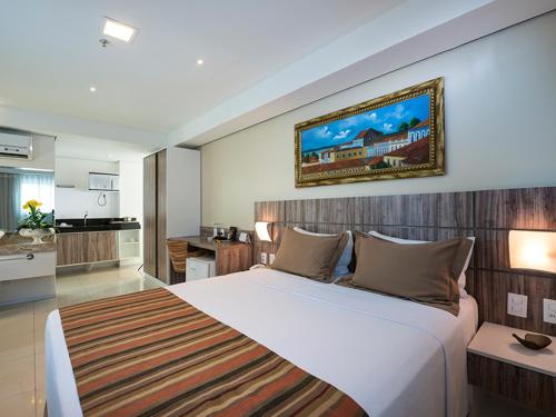 מיטה או מיטות בחדר ב-Profissionalle Hotel São Luís