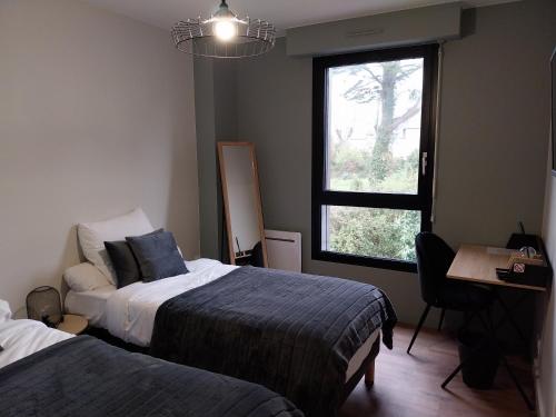 Postel nebo postele na pokoji v ubytování le Ricordeau