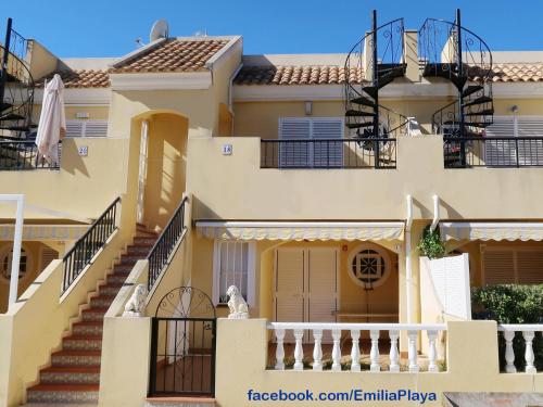 a house with stairs in front of it at Emilia de la Playa in La Mata