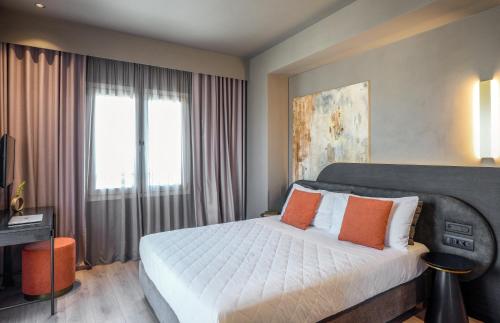 Katil atau katil-katil dalam bilik di Arcadion Hotel