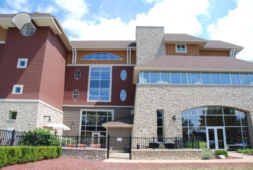 a large brick building with windows on it at Beautiful First Floor suite with patio to the Bay in Traverse City
