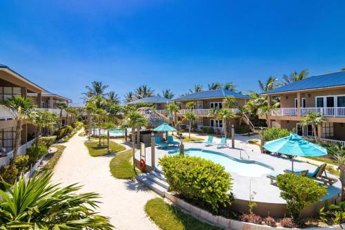 a resort with a swimming pool and a resort at Sapphire Beach Condo in San Pedro