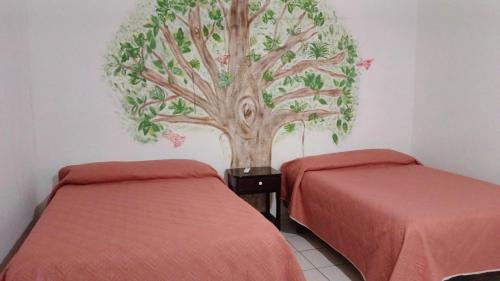 Ένα ή περισσότερα κρεβάτια σε δωμάτιο στο Hotel Casa la conchita