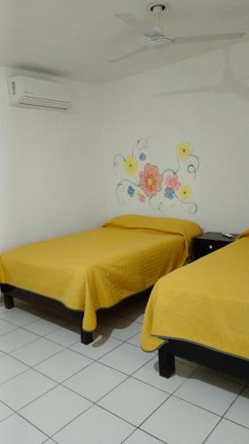 Ένα ή περισσότερα κρεβάτια σε δωμάτιο στο Hotel Casa la conchita