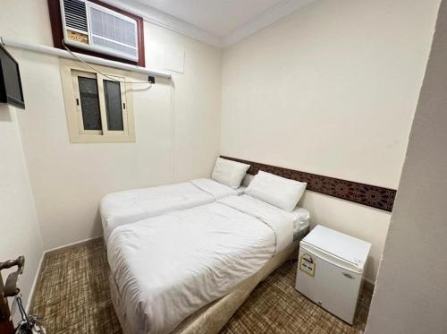 Ένα ή περισσότερα κρεβάτια σε δωμάτιο στο فندق لاكجري
