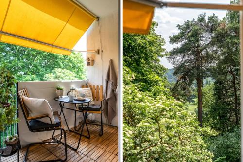 a balcony with a table and a large window at Danderyd/kevinge in Danderyd