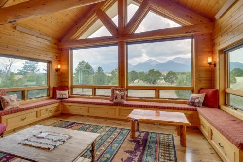a room with benches and windows in a log cabin at The Fox Den 360 Mtn View and On-Site Hiking! in Nathrop