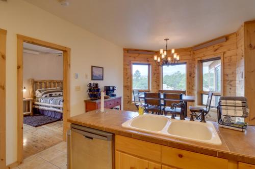 a kitchen with a sink and a bedroom with a bed at The Fox Den 360 Mtn View and On-Site Hiking! in Nathrop