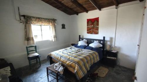 Säng eller sängar i ett rum på Hospedaje Serrano Suyuque Viejo