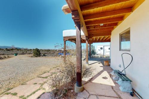 a porch of a house with a wooden roof at Pow Days Taos in Taos