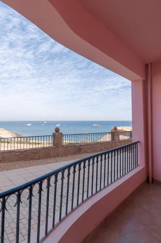 a balcony with a view of the ocean at La Siesta Hotel Al Sokhna in Ain Sokhna