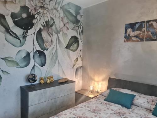 Ένα ή περισσότερα κρεβάτια σε δωμάτιο στο Perla B&B