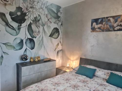 Ένα ή περισσότερα κρεβάτια σε δωμάτιο στο Perla B&B
