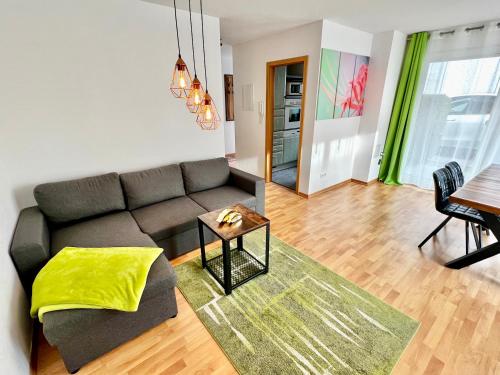a living room with a couch and a table at Elbflair in Pirna