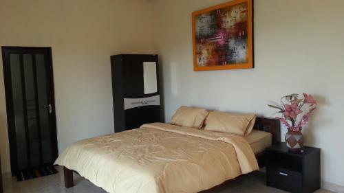 Ένα ή περισσότερα κρεβάτια σε δωμάτιο στο DSTAY Kost Bali